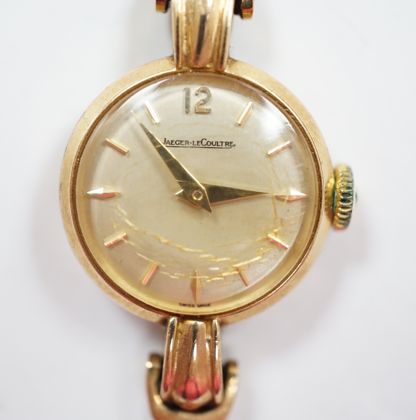 A lady's 9ct gold Jaeger LeCoultre manual wind wrist watch, on an associated 9ct gold bracelet, overall 16.8cm, gross weight 20.4 grams.